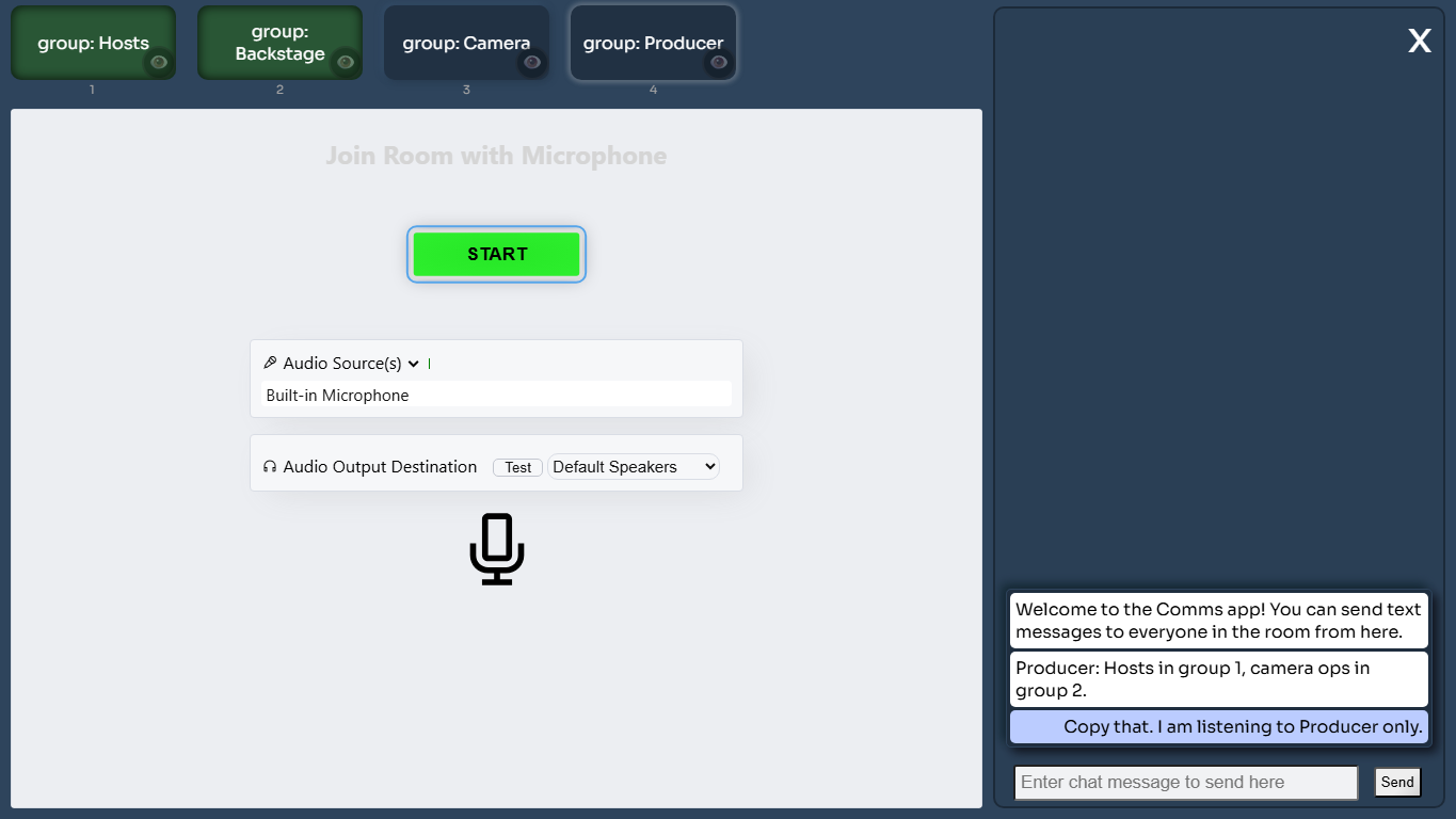 Comms desktop room with group buttons, microphone setup, and chat